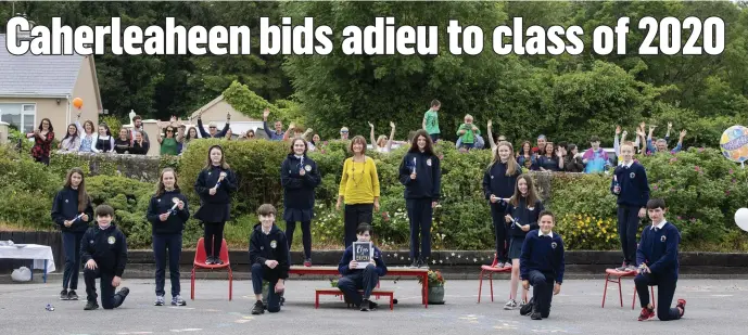  ?? All photos by Domnick Walsh. ?? One of the sixth-class groups who graduated from Caherleahe­en NS last week pictured with Principal Mary Connolly and parents.