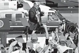  ?? MATT YORK/AP ?? President Donald Trump is cheered by supporters after speaking at a campaign rally Monday in Prescott, Arizona.