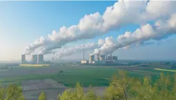  ?? SEAN GALLUP/GETTY ?? Steam rises in April at coal-fired power plants in Neurath, Germany.