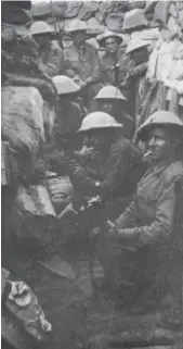 ?? ?? Men in the 53rd Battalion pictured as they were waiting to attack at Fromelles. Only three of the soldiers shown here came out of the action alive, and they were wounded.