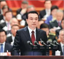  ?? XU JINGXING / CHINA DAILY ?? Premier Li Keqiang delivers the Government Work Report at the opening meeting of the first session of the 13th National People’s Congress at the Great Hall of the People in Beijing on Monday.