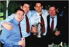  ??  ?? Johnny O’Toole, Barry O’Neill, Quenton O’Neal, Billy Byrne celebrate Arklow RFC’s Towns Cup success in 2004.