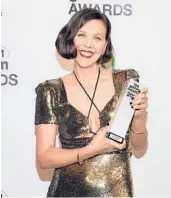  ?? EVAN AGOSTINI/INVISION ?? Maggie Gyllenhaal with the best screenplay award at the Gotham Awards on Monday.