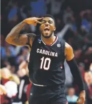  ??  ?? Duane Notice of South Carolina exults during the Gamecocks’ victory against Duke on Sunday.