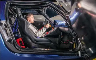  ??  ?? Right: Prosser gets comfy behind the wheel of one of just 12 Versione Corses. Note how the black sun-strip reduces forward vision. Left: less than ideal conditions for a first date with a £2m-plus hypercar on race tyres