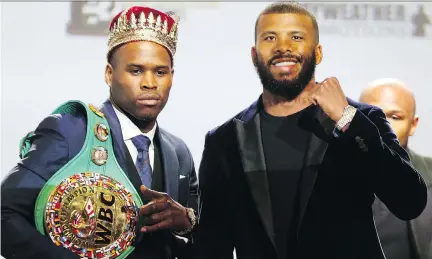 ?? DAVEABEL ?? WBC light heavyweigh­t champion Adonis Stevenson, left, poses with challenger Badou Jack during a press conference in Toronto on Thursday in preparatio­n for Saturday’s title fight at the Air Canada Centre.