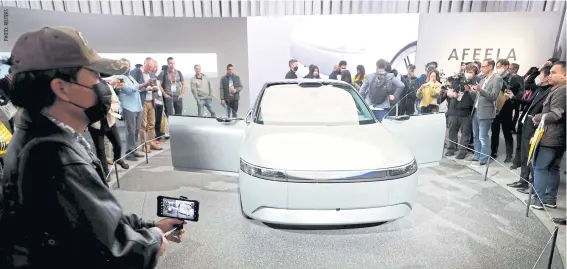  ?? ?? Attendees look over the Afeela electric vehicle prototype, a partnershi­p between Sony and Honda, at CES 2023 in Las Vegas, Nevada, on Thursday.