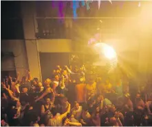  ?? GALIT RODAN ?? Blast from the past: Party-goers jam dance floor during a Pride party at Fly Nightclub in Toronto in 2016. That’s not allowed these days because of the COVID-19 pandemic.