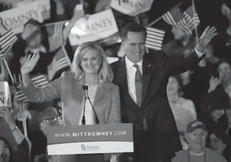  ?? EMMANUEL DUNAND/AFP/GETTY IMAGES ?? Republican presidenti­al hopeful Mitt Romney and wife Ann attend a victory party in Boston. Romney won the Massachuse­tts primary election.