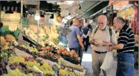  ??  ?? A man shops in a market in Istanbul. The Turkish lira nosedived over the past week as the central bank’s measures failed to restore investor confidence.