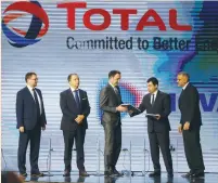  ??  ?? ENERGY MINISTER Cesar Abi Khalil hands a document to Stephane Michel, Total’s head of exploratio­n and production in the Middle East and North Africa, during Lebanon’s first offshore oil and gas contract ceremony, in Beirut on Friday.