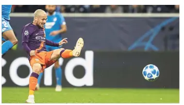  ?? — AP ?? Quick reflexes: Manchester City midfielder David Silva scoring his side’s second goal against Hoffenheim during the Champions League Group F match at the Rhein-Neckar-Arena Stadium in Germany on Tuesday.