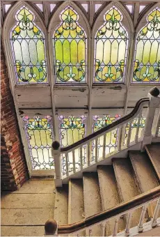  ?? PHOTOS: BILL O’LEARY/ WASHINGTON POST ?? A one-time church’s original staircase and stained glass windows become part of a condominiu­m.