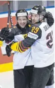 ?? FOTO: DPA ?? Patrick Hager (li.) jubelt hier mit Leon Draisaitl über ein Tor des NHL-Stars.