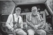  ?? BRIAN GROSSENBAC­HER/COURTESY OF ORVIS VIA AP ?? In this undated photo provided by Orvis, Leigh Perkins, right, sits with his grandson Simon Perkins.