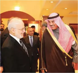  ?? — KUNA ?? KUWAIT: First Deputy Prime Minister and Foreign Minister Sheikh Sabah Khaled Al-Sabah bids farewell to Iraqi Foreign Minister Ibrahim Al-Jaafari at Kuwait Internatio­nal Airport. Jaafari concluded his visit to Kuwait yesterday.