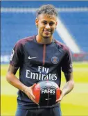  ?? Michel Euler ?? The Associated Press Brazilian soccer star Neymar poses for a photo following a press conference in Paris Friday after his blockbuste­r move to Paris Saint-germain.