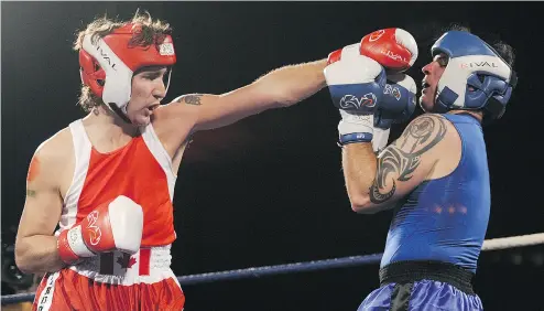  ?? CHRIS ROUSSAKIS / POSTMEDIA NEWS FILES ?? Then-Liberal MP Justin Trudeau lands a punch on Conservati­ve Sen. Patrick Brazeau in a 2012 charity boxing match.