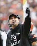  ?? ?? Bengals coach Zac Taylor argues a call during the first quarter of Sunday’s game against the Ravens in Cincinnati.