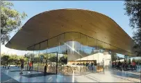  ??  ?? The visitor center features a cafe, an exhibition area, an Apple store and rooftop seating area where tourists can view the campus.