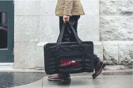  ?? FILE ?? SkipTheDis­hes is a Canadian company recently bought out by Just Eats in Britain in a deal reportedly worth up to $200 million. It is one of several food delivery apps Edmontonia­ns can now use.