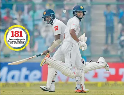  ?? PTI ?? Runs partnershi­p between Mathews and Chandimal Lanka’s Chandimal (right) and Mathews take a run during third day of the third Test match against India in New Delhi on Monday. —