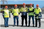  ??  ?? Corteva Agriscienc­e project team Claire Nolan, left, Mark Gelenhuys, Steve Grant, Dave Clarke, and Tony Gellen in front of the upgraded chemical storage compound.