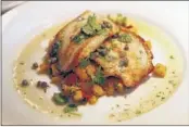  ??  ?? One of Iris’ featured entrees is the sauteed pacific turbot grenoblois­e with local fava bean and butternut squash. )