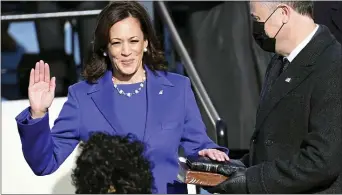  ?? SAUL LOEB — POOL PHOTO VIA AP ?? Kamala Harris is sworn in as vice president by Supreme Court Justice Sonia Sotomayor as her husband Doug Emhoff holds the Bible during the 59th Presidenti­al Inaugurati­on at the U.S. Capitol in Washington, Wednesday, Jan. 20, 2021.