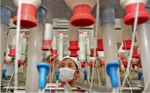  ?? AP ?? China’s economy has surprised with growth of nearly seven per cent this year, driven by a renaissanc­e in its ‘smokestack’ industries, such as steel. —