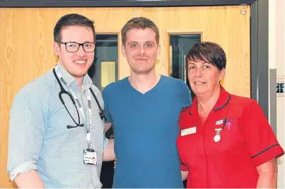  ?? Picture: PA. ?? Matthew Bryce, centre, with consultant physician Dr Padraig Headley, left, and ward sister Rhonda Marks.