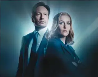  ??  ?? David Duchovny and Gillian Anderson star in “The X-Files”