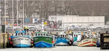  ?? Picture: PHILIPPE HUGUEN/AFP ?? French trawlers block the entrance to Boulogne’s port yesterday as part of the demonstrat­ion