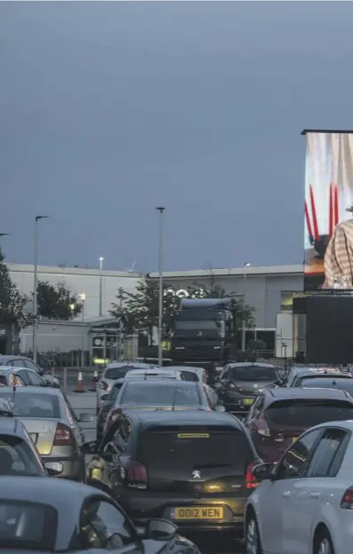  ??  ?? 0 As further lockdown easing measure were announced drive-in movies arrived at Intu Braehead, Glasgow, for the first time last night. Movie-goers could choose from classics Grease and Back to the Future `