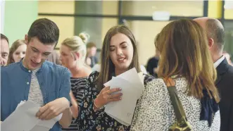  ?? ?? Pupils at St Roberts of Newminster, Washington, receive their results.