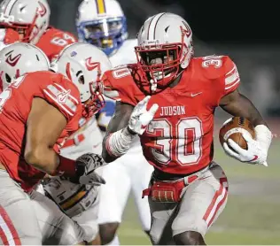  ?? Tom Reel / Staff photograph­er ?? Judson’s De’anthony Lewis maneuvers around blockers to gain some of his 252 rushing yards Thursday against Clemens. Lewis also scored twice, once on the ground and once through the air.