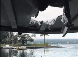  ??  ?? Hawaii Department of Land and Natural Resources A tour boat is damaged after an explosion sent lava flying through the roof Monday off the Big Island of Hawaii, injuring at least 23 people.