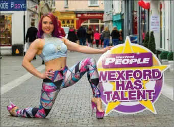  ??  ?? Pole artist Danielle Reck, a runner-up in last year’s Wexford Has Talent final, on North Main Street in Wexford promoting this year’s event.