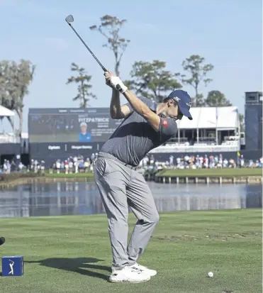  ?? ?? Matthew Fitzpatric­k hits from the 17th tee during the second round of The Players Championsh­ip in Ponte Vedra Beach. Below, Wyndham Clark has carded a brace of 65s