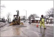  ?? KAREN PULFER FOCHT — THE ASSOCIATED PRESS ?? Memphis Light Gas & Waterworke­rs make repairs to a broken water main in north Memphis, Tenn., on Monday.