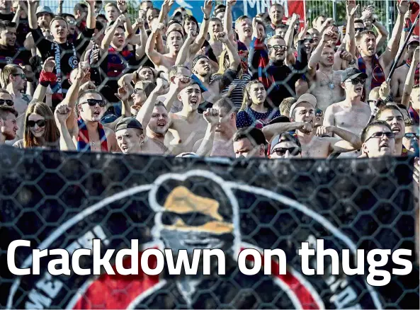  ?? — AFP ?? Loud and dangerous: CSKA Moscow supporters chanting during a Russian Premier League match against Ural Yekaterinb­urg in Yekaterinb­urg in August.