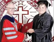  ??  ?? Jayse Anderson receives a diploma from College of the Ozarks President Jerry C. Davis.