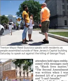  ??  ?? Trenton Mayor Reed Gusciora speaks with residents as people assembled outside of New Jersey’s Capitol building Saturday to speak out against the killing of George Floyd.