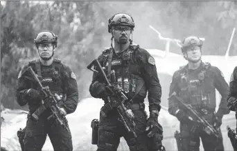  ??  ?? David Lim, Shemar Moore and Kenny Johnson in “S.W.A.T.”