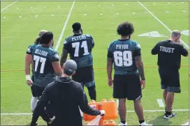  ?? MEDIANEWS GROUP PHOTO ?? The ranks of injured Eagles offensive linemen are swelling, with an illness forcing Matt Pryor, right, to join Andre Dillard (biceps) and Jason Peters (toe) on the sidelines at practice this week and on Sunday when the Ravens visit the Linc.