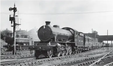  ?? Colling Turner/Rail Archive Stephenson ?? Setting out on a 119 mile test run along the Western Region main line to South Wales, Thompson ‘O1’ class 2-8-0 No 63773 is coupled to and being recorded by the ex-NER/LNER dynamomete­r car as it pulls slowly out of Acton yard in West London with the 11.20am test train for Stoke Gifford and then Severn Tunnel Junction yard on Tuesday, 31 August 1948. It is seen passing one of Acton yard’s ‘8750’ class pannier tanks with Noel Road bridge in the background. Although the Thompson 100A boiler did not reach the levels of efficiency of the Churchward and Stanier boilers, the modern well-designed front end more than compensate­d and No 63773 produced some of the highest power outputs recorded.