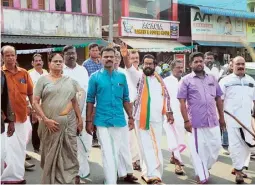  ?? SPECIAL ARRANGEMEN­T ?? LDF candidate C. Raveendran­ath campaignin­g at Kodungallo­or; UDF candidate Benny Behanan at Vengola; and NDA candidate K.A. Unnikrishn­an at Thiruvaniy­oor.