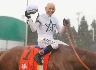 ?? (Brian Spurlock-USA TODAY Sports/Reuters) ?? MIKE SMITH aboard Justify (7) celebrates after winning the 144th running of the Kentucky Derby at Churchill Downs on Sunday.
