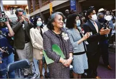  ?? Arnold Gold / Hearst Connecticu­t Media ?? Former New Haven Mayor Toni N. Harp, center, is applauded after her portrait was unveiled at City Hall on Tuesday.