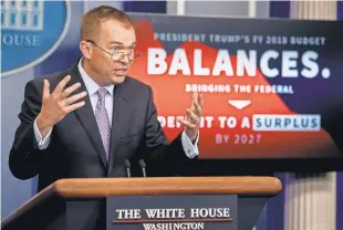  ?? ANDREW HARNIK, AP ?? Budget Director Mick Mulvaney, speaking at a budget news briefing Tuesday, says President Trump’s proposal wouldn’t kick anyone off any federal program who really needs it.